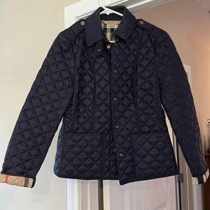 Navy blue Burberry Brit jacket. I wore this once and it’s in great condition.